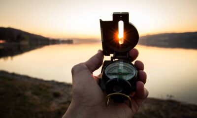 person showing black and white compass