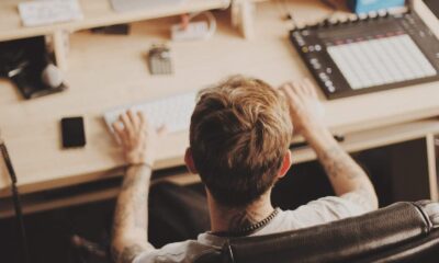 man sitting on rolling chair
