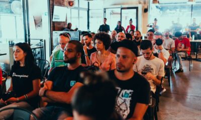 Photo Of People Sitting On Chairs